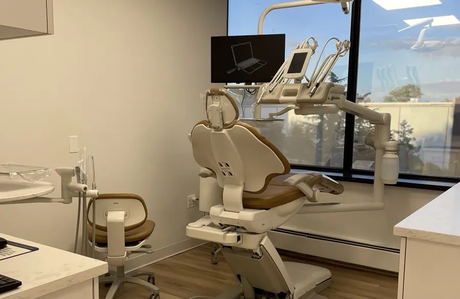 A dental chair facing a wall-mounted monitor, at the Seaview Boulevard office.